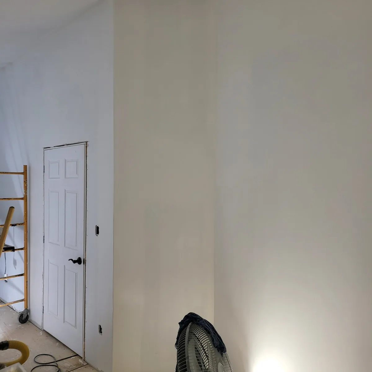 Interior room with the drywall finished and painted, ready for flooring and trim